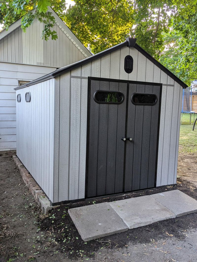 8x12 resin storage shed installed in Belleville Ontario backyard